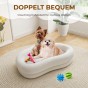 Im Hundebett „Wolke“ liegen zwei kleine Hunde.