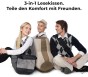 Drei junge Leute sitzen um ein großes, geometrisches Kissen herum.