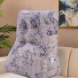 Vielseitiges Lesekissen mit Schmetterlingsmuster, arrangiert im Wohnzimmer.